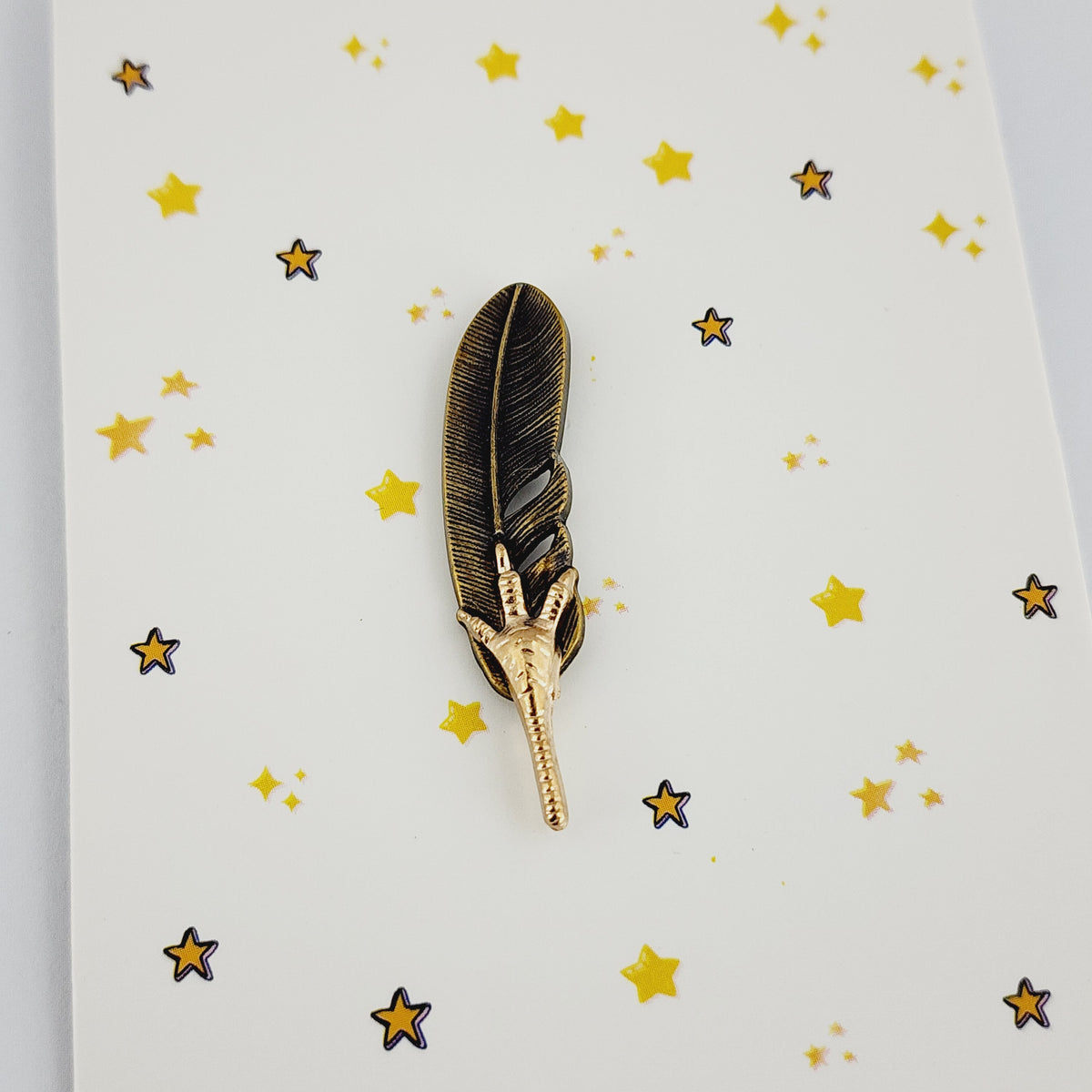 FEATHER & FANG LAPEL PIN