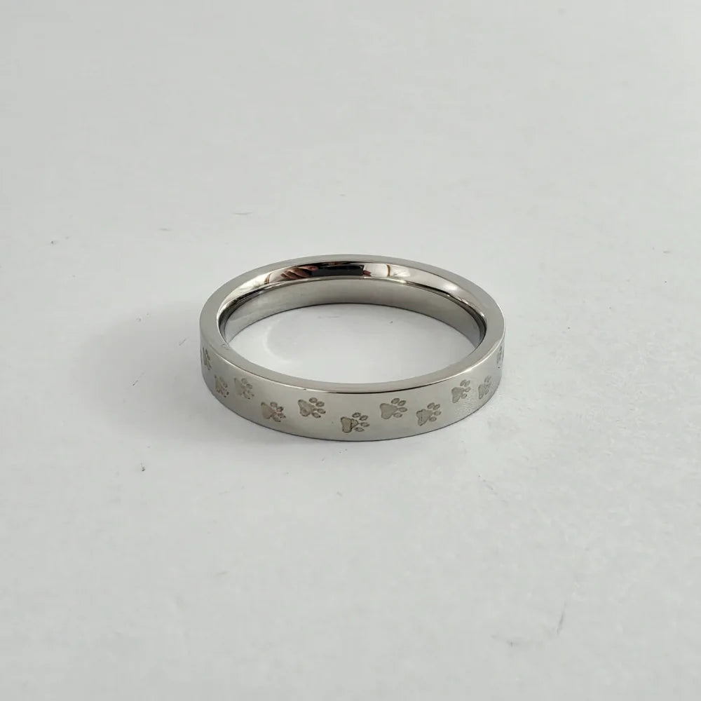 PAW PRINT ELEGANCE STAINLESS STEEL TIE RING