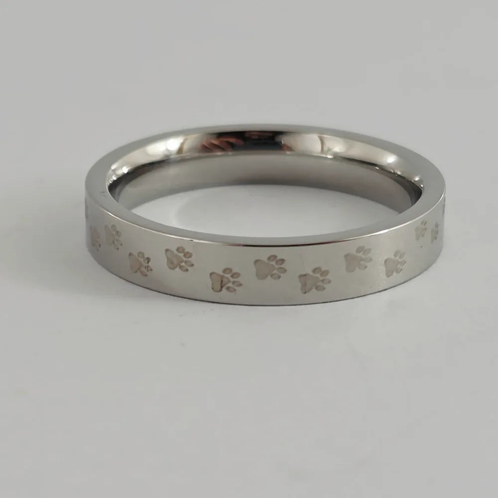 PAW PRINT ELEGANCE STAINLESS STEEL TIE RING